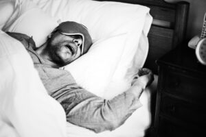 black and white photo man snoring sleeping
