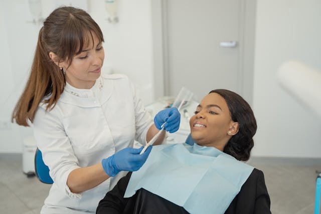 dentist treating patient dentist treating patient