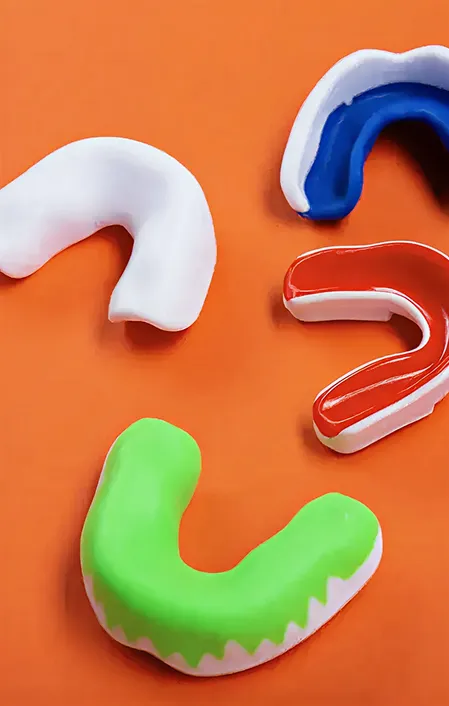4 different coloured sports mouth guards