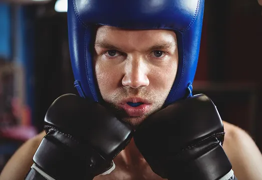 boxer wearing black sports mouth guard