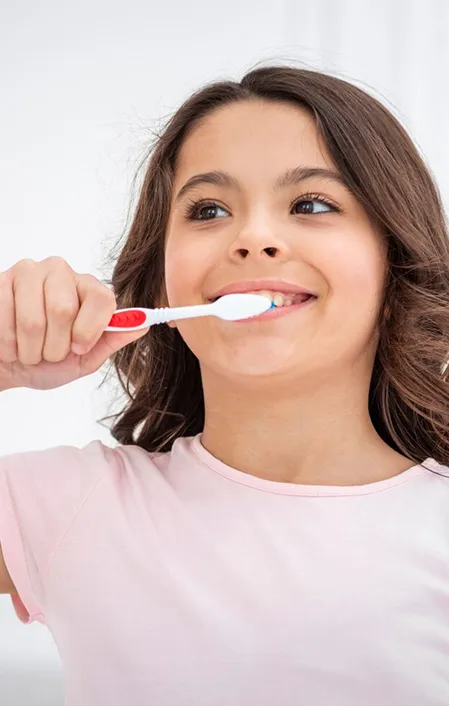 young kid brushing teeth