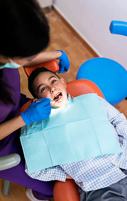young child getting dental silver diamine fluoride treatment