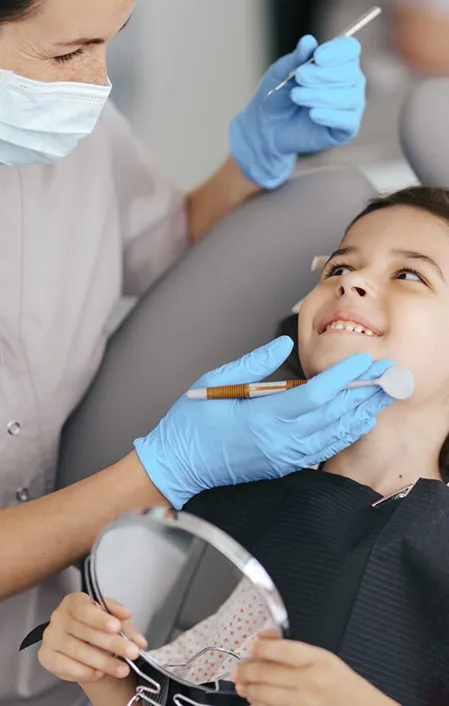 young child getting dental silver diamine fluoride treatment