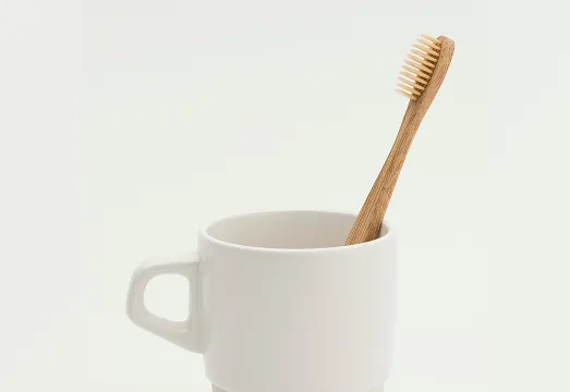 bamboo toothbrush in cup