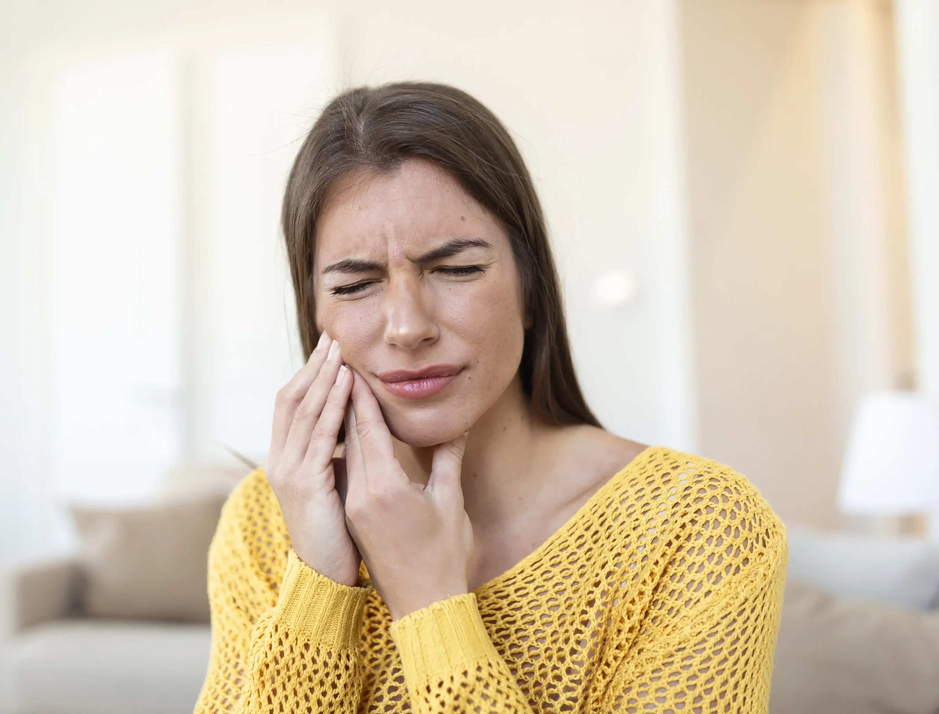 wisdom Tooth Pain holding side of face