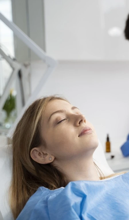 Patient Sleeping In Dental Chair Feeling Relaxed