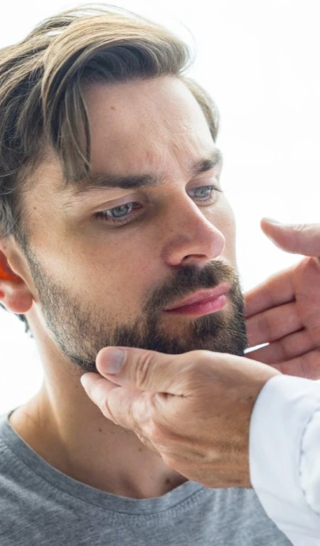 Man Getting Jaw Pain Treatment Portrait