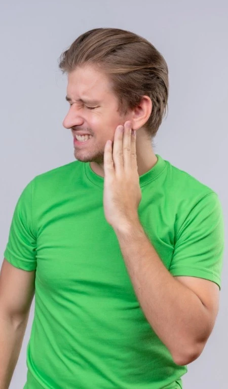 Man In Green Shirt With Jaw Pain Ache Portrait
